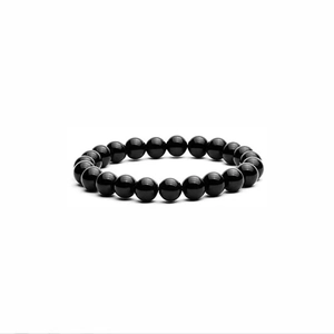 Detailed view of polished 8mm black volcanic stone beads on an elastic bracelet