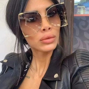 Fashionable oversized square sunglasses with gradient brown lenses and gold frames