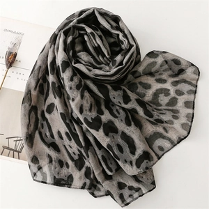 Detailed view of lightweight leopard print scarf with soft texture and chic patterns