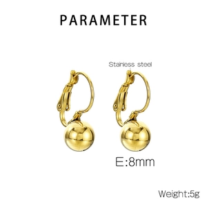 Detail view of gold stainless steel oval earrings with 8mm ball charms weighing 5g