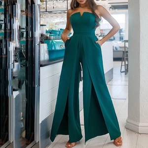 Sleeveless deep green jumpsuit with V-neckline and front slit wide leg trousers