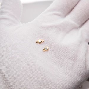 Close-up of 925 sterling silver gold-plated pendants with cubic zirconia for DIY jewelry