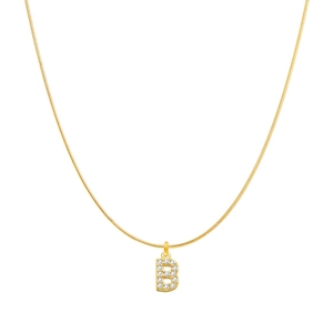 Macro view of gold-plated snake chain and letter B pendant with sparkling cubic zirconia