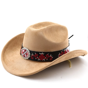 Detail of khaki suede cowboy hat featuring red flower embroidery and silver badge on band
