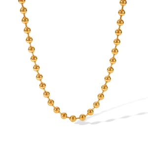 Detail shot of a polished 18K gold-plated stainless steel ball chain with metallic luster