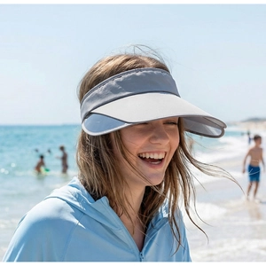 Detail of grey sun visor hat with adjustable side panels and breathable synthetic fabric