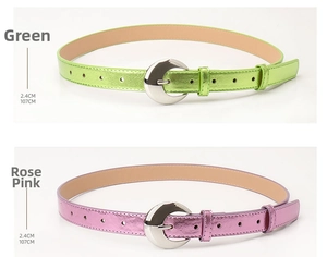 Close-up of green and rose red fashion belts with silver buckles for dresses