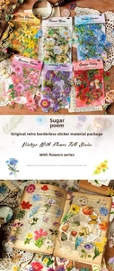 Detail view of vintage botanical stickers applied on old book pages for journaling