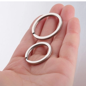 Macro detail of polished silver stainless steel key rings in two different sizes