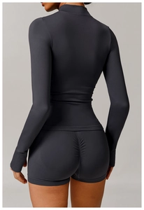 Close-up of ruched back seam on high-waist dark grey sports shorts for butt lifting