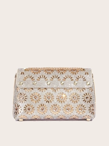 Detailed view of sunflower rhinestone pattern on elegant evening clutch bag with gold chain