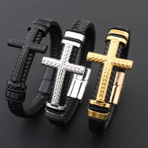 Three men's woven leather bracelets with cross charms in black, gold and silver