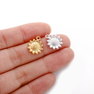 Detailed pair of gold and silver stainless steel sunflower pendants for jewelry making