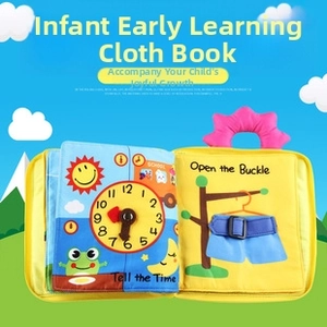 Detail view of baby educational cloth book featuring clock and buckle skill modules