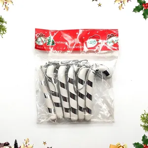 Silver and white Christmas candy cane ornaments in plastic packaging with weight detail