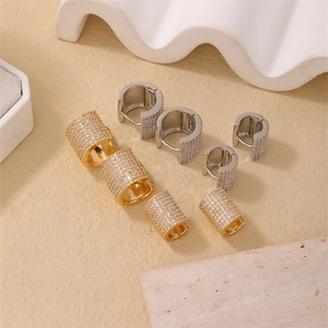 Three sizes of luxury gold and silver hoop earrings with pavé cubic zirconia inlay