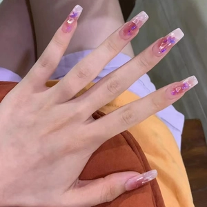 Pink and purple gradient press-on nails with glitter sequins in a jelly finish