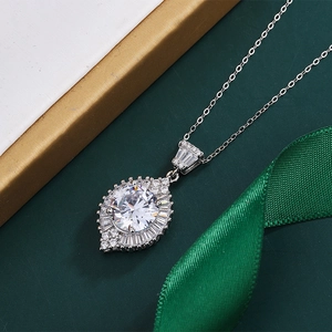 Macro shot of 2ct round zircon pendant on thin silver chain with elegant gift box