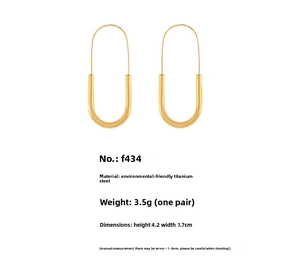 Detail view of gold U-shaped paperclip earrings in titanium steel with measurements