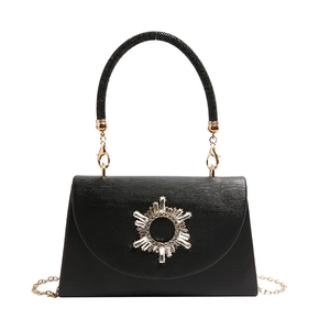 Elegant black crossbody bag with rhinestone star ornament and golden chain strap