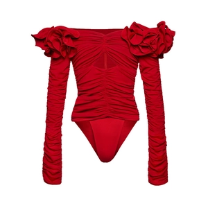 Detail of red off-shoulder bodysuit with 3D floral accents and ruched texture details