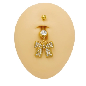 Golden stainless steel bowknot belly button ring with full crystal pavé on mannequin