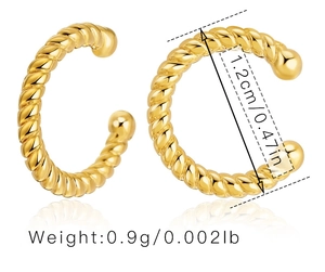 Detailed close-up of rope twist C-shaped gold ear cuffs with smooth ball ends