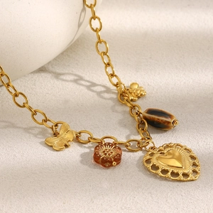 Detail view of 18K gold plated charm bracelet with butterfly, bee, and heart pendants