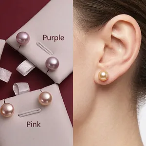 Detail showing natural purple and pink freshwater pearl earrings worn on ear lobes
