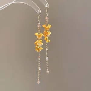 Elegant long yellow osmanthus flower tassel earrings with delicate golden chains