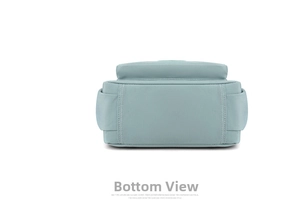 Detail view of reinforced stitching on the bottom of this blue nylon crossbody bag
