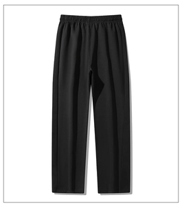 Detail of men's casual black trousers featuring an elastic waistband and premium fabric