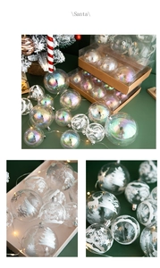 Detail of rainbow-effect clear Christmas ornaments with deer and forest patterns in a gift box