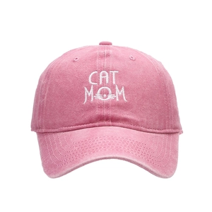 Distressed rose pink baseball cap featuring white CAT MOM embroidery and curved brim