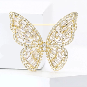 Detailed view of luxury butterfly brooch with sparkling cubic zirconia on gold metal