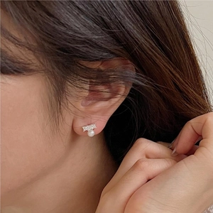 Elegant 925 sterling silver pearl earrings with zircon inlay worn by model