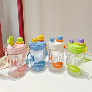 Detailed view of four colorful children's straw cups with straps in pink, blue, white, and green