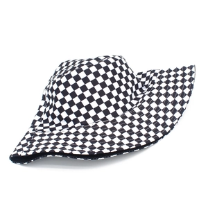 Close-up of checkerboard pattern bucket hat with black and white grid fabric detail