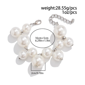 Detail view of large white pearl bracelet showing dimensions and polished silver clasp
