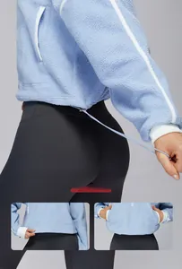 Women's light blue fleece jacket featuring adjustable drawstring hem for two wearing styles