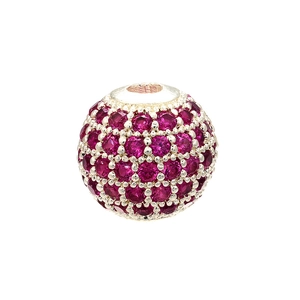 Detail of round silver bead with pavé magenta gemstones and center hole for DIY jewelry