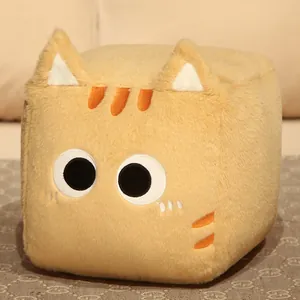 Close-up of square ginger cat plush pillow showing soft texture and embroidered details