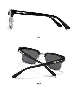Detail view of black square sunglasses featuring silver metal bridge and sword accents