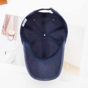 Navy blue vintage washed cotton baseball cap with adjustable metal buckle and retro style