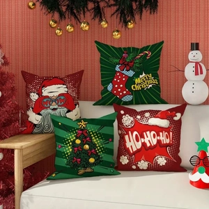 Detail view of four Christmas pillow covers with Santa motifs on a white sofa