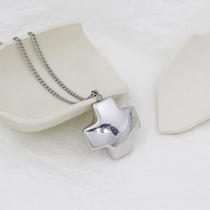 Polished silver stainless steel hollow cross necklace with a minimalist mirror finish
