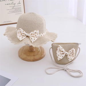 Straw sun hat and matching bag set for girls with brown polka dot bow details