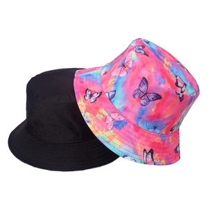 Detailed view of dual-pack sun hats featuring a black solid and pink butterfly tie-dye design