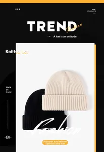 Close-up of ribbed knit beanies in cream and black showing thick winter texture