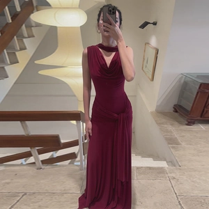 Detail of burgundy backless maxi dress with mesh stitching and slim-fit lace-up design
